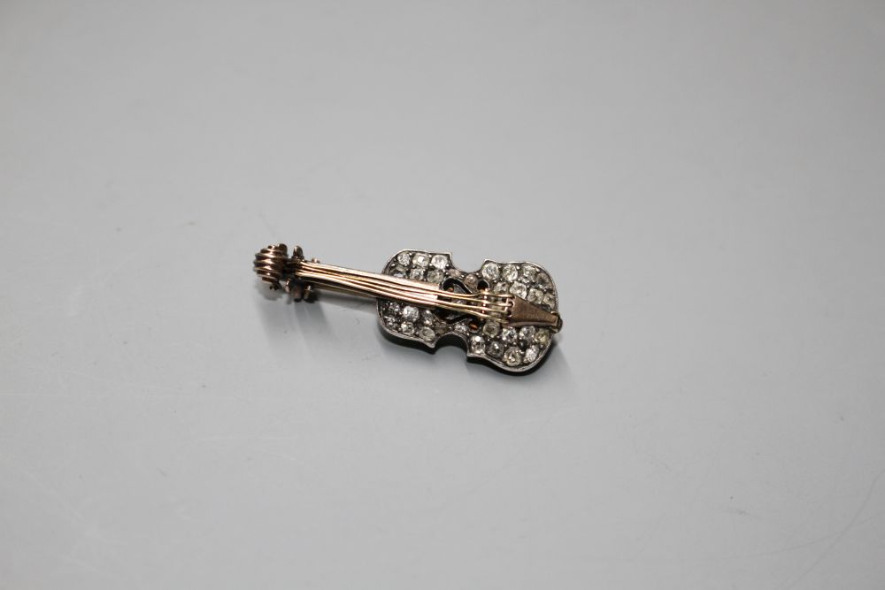 A late Victorian yellow and white metal and rose cut diamond set novelty brooch, modelled as a violin,